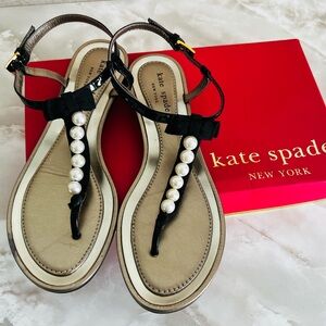 Kate Spade flat sandals with pearl and bow tie accents